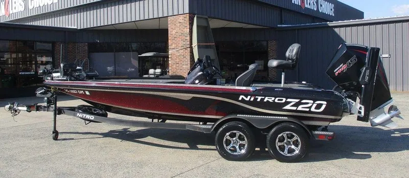Slide: The Image of 2019 Nitro Z20 boat parked outside a dealership, showcasing sleek design and modern features. - 1