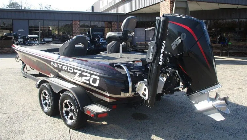 Slide: The Image of 2019 Nitro Z20 boat with powerful engine, parked outdoors on a sunny day. - 3