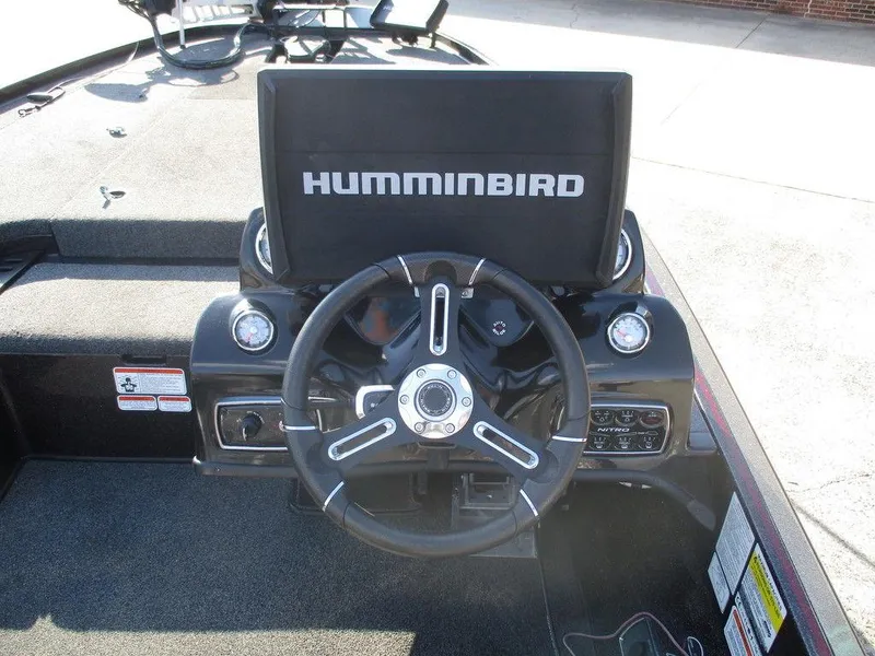 Slide: The Image of 2019 Nitro Z20 boat dashboard with Humminbird display and steering wheel. - 7