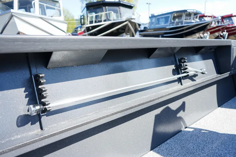 Slide: The Image of 2025 Alumaweld Adventurer 20 boat interior detail with rod holders, showcasing sleek design. - 11