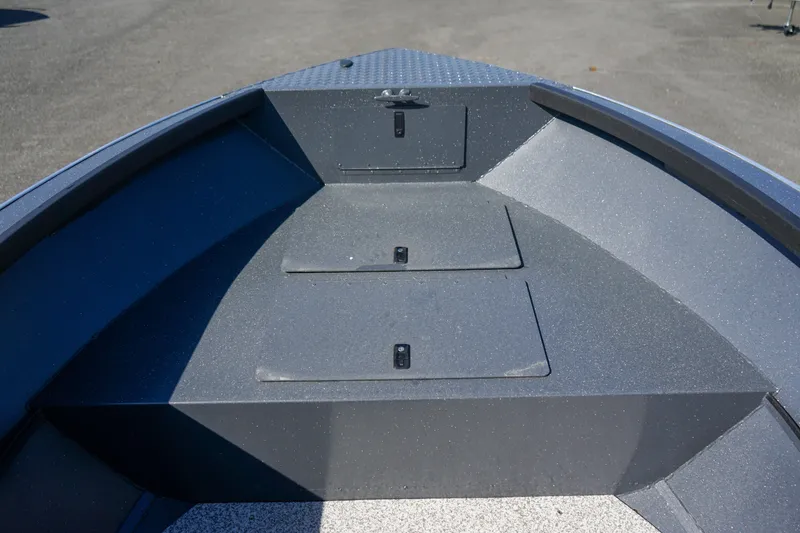 Slide: The Image of 2025 Alumaweld Adventurer 20 boat interior with storage compartments. - 20