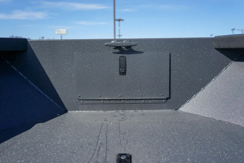 Slide: The Image of 2025 Alumaweld Adventurer 20 boat interior with storage compartment and cleat. - 21