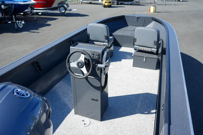 Slide: The Image of 2025 Alumaweld Adventurer 20 boat interior with steering console and seating. - 7