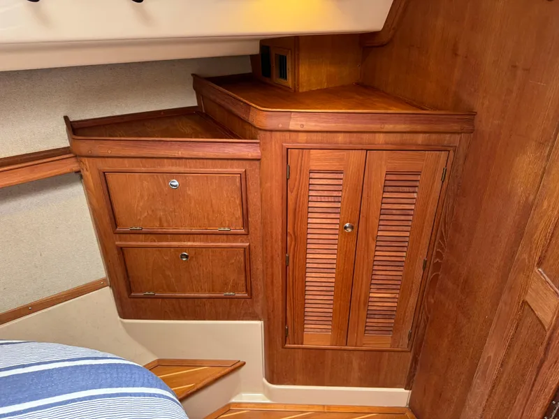 Slide: The Image of Interior wood cabinetry on a 2002 Island Packet 380 sailboat. - 12