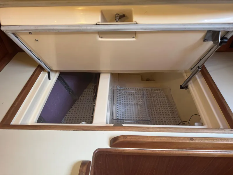 Slide: The Image of Interior storage compartments of a 2002 Island Packet 380 sailboat. - 18