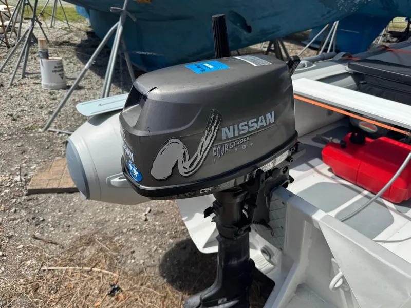 Slide: The Image of Nissan four-stroke outboard motor on a boat, Island Packet 380, 2002 model. - 28
