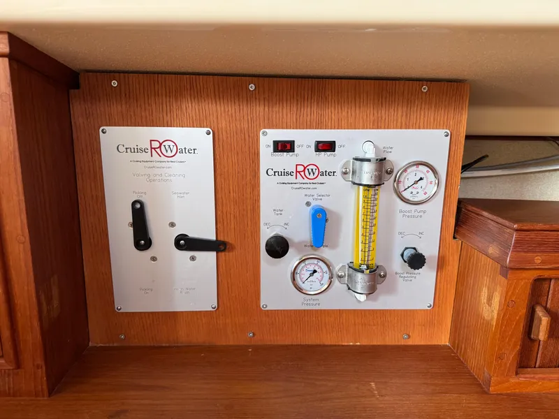 Slide: The Image of Control panel of a 2002 Island Packet 380 sailboat, featuring Cruise RO Water system. - 29