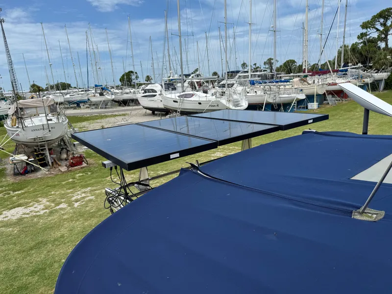 Slide: The Image of Solar panels on a 2002 Island Packet 380 yacht in a marina. - 39