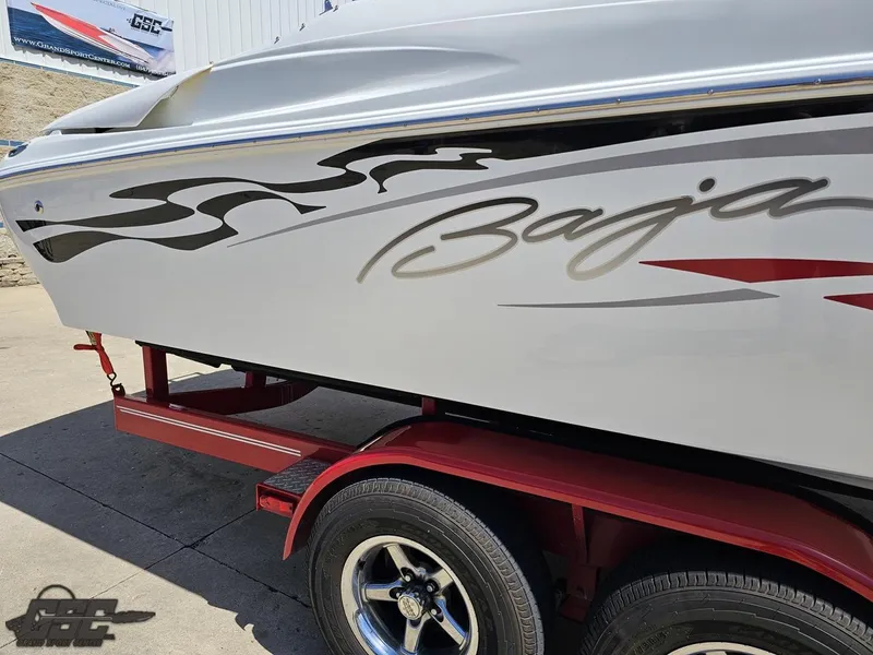 Slide: The Image of 2004 Baja 275 boat on red trailer with stylish graphics. - 10