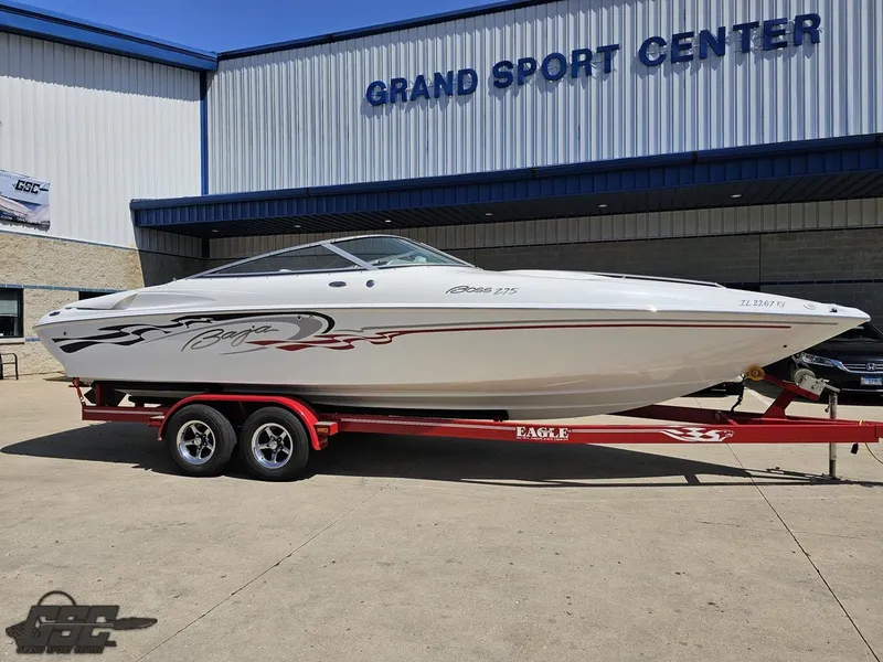 Slide: The Image of 2004 Baja 275 speedboat on red trailer at Grand Sport Center. - 14