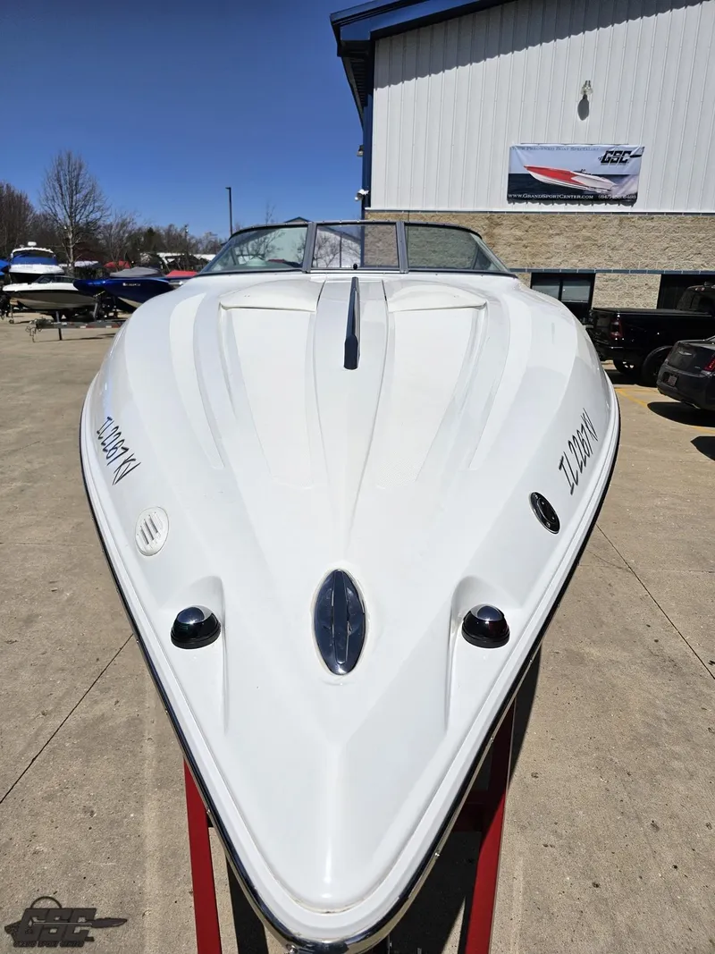 Slide: The Image of 2004 Baja 275 speedboat displayed outdoors, showcasing sleek design and white hull. - 16