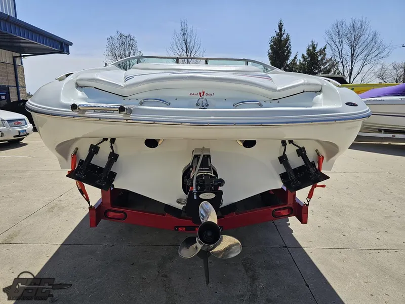 Slide: The Image of 2004 Baja 275 boat on trailer, rear view, outdoors, sunny day. - 28