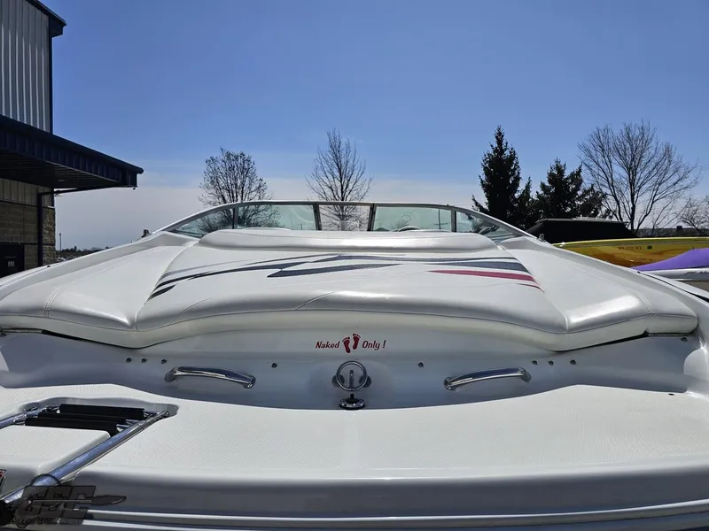 Slide: The Image of 2004 Baja 275 boat rear view with sleek design and white upholstery. - 29
