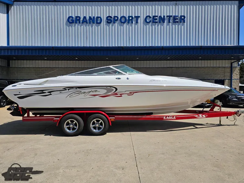 Slide: The Image of 2004 Baja 275 boat on a red trailer at Grand Sport Center. - 3