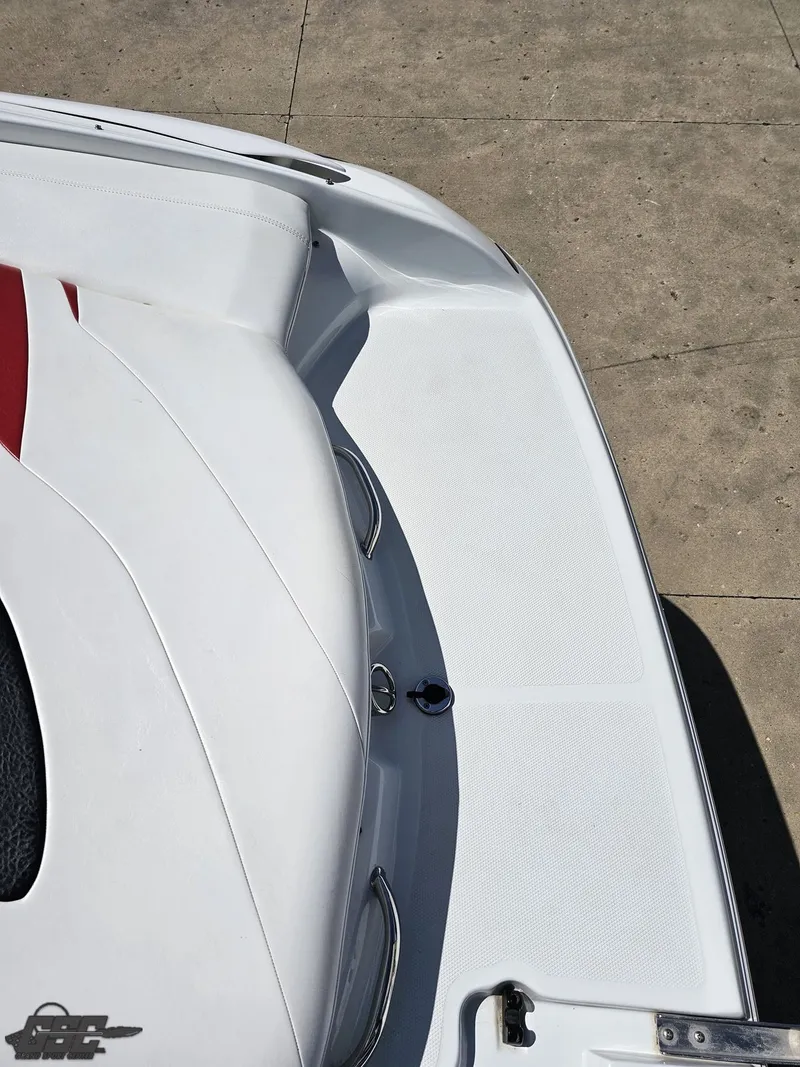 Slide: The Image of 2004 Baja 275 boat deck with white and red seating, viewed from above. - 34