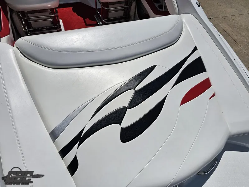 Slide: The Image of 2004 Baja 275 boat seat with stylish black and red wave design. - 35