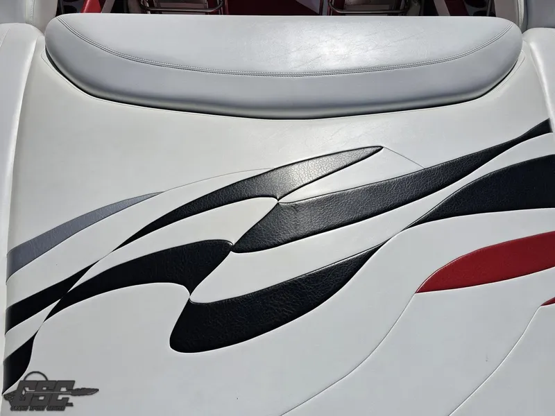 Slide: The Image of 2004 Baja 275 boat seat with sleek black and red wave design. - 38