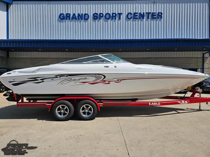 Slide: The Image of 2004 Baja 275 speedboat on red trailer at Grand Sport Center. - 4