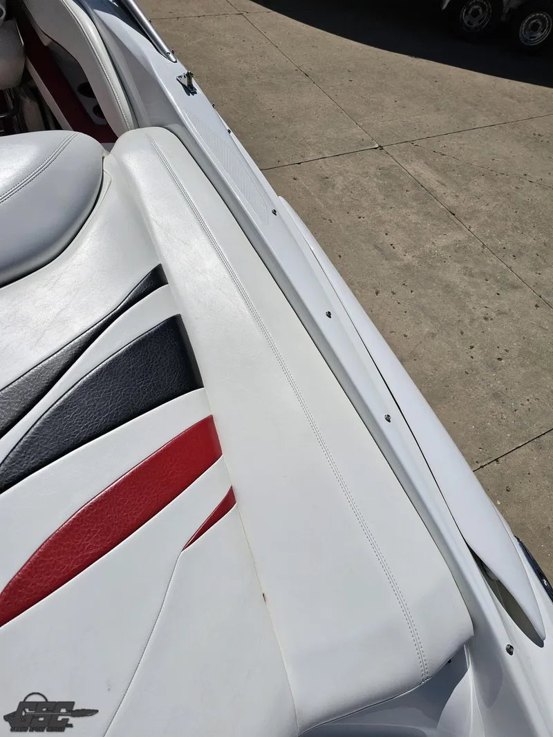 Slide: The Image of 2004 Baja 275 boat interior with white, red, and black upholstery details. - 41