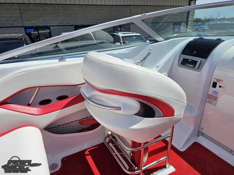 Slide: The Image of 2004 Baja 275 boat interior with white and red seating, sleek dashboard, and modern design. - 47