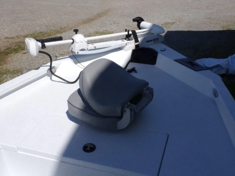 Slide: The Image of 2025 Xpress H20BAY boat with a trolling motor and cushioned seat on deck. - 11