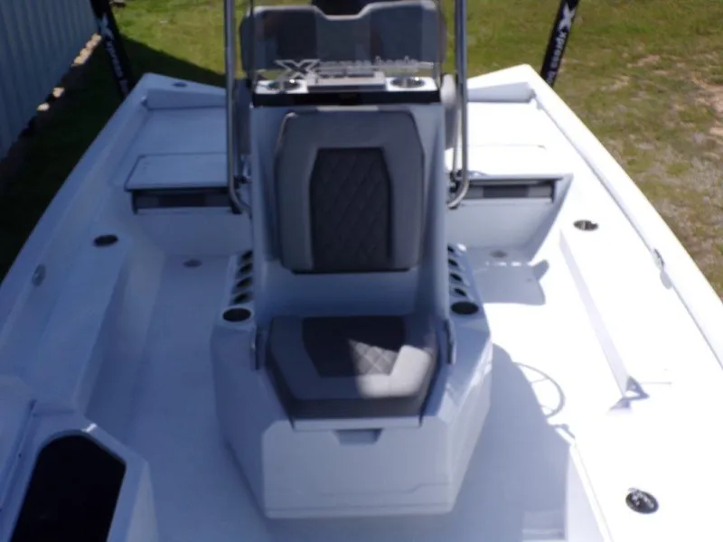 Slide: The Image of 2025 Xpress H20BAY boat interior with center console and seating, featuring modern design. - 14