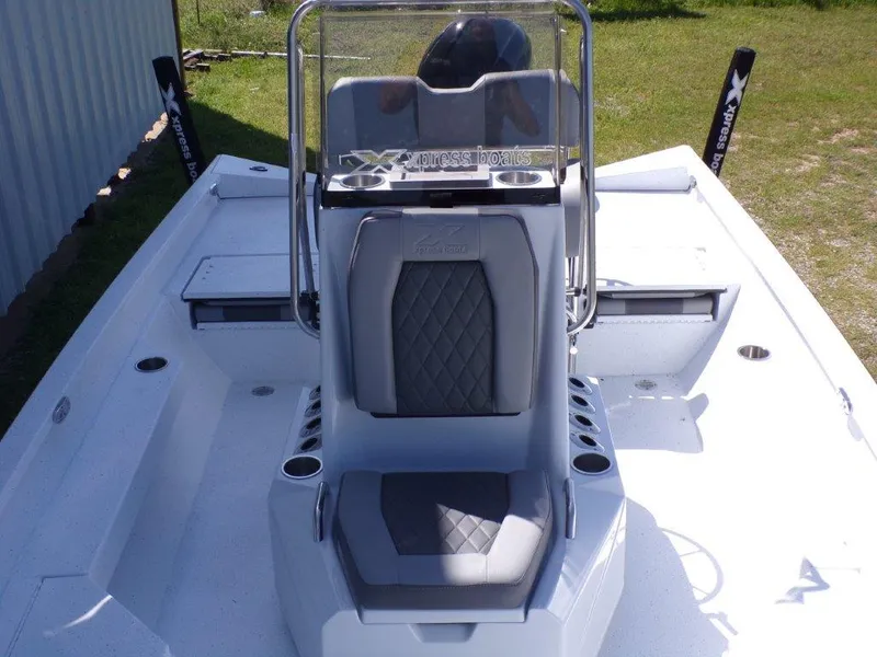 Slide: The Image of 2025 Xpress H20BAY boat with sleek seating and modern console design. - 15