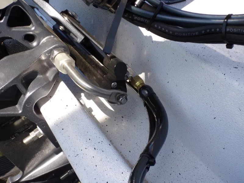 Slide: The Image of Close-up of 2025 Xpress H20BAY boat's engine components and wiring. - 17