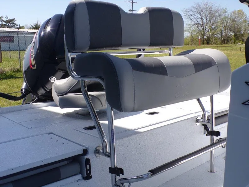 Slide: The Image of 2025 Xpress H20BAY boat with gray seating and sleek design. - 22