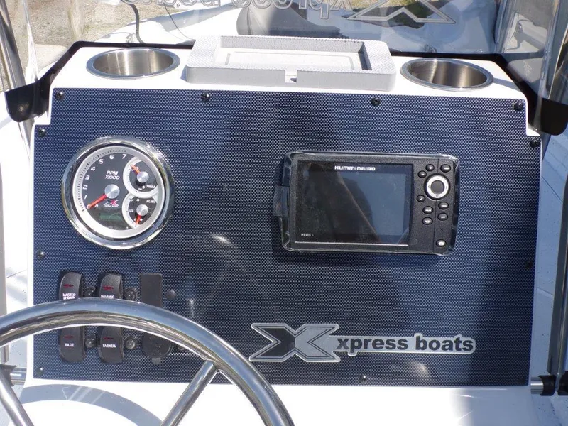 Slide: The Image of Dashboard of 2025 Xpress H20BAY boat with gauges and navigation system. - 23