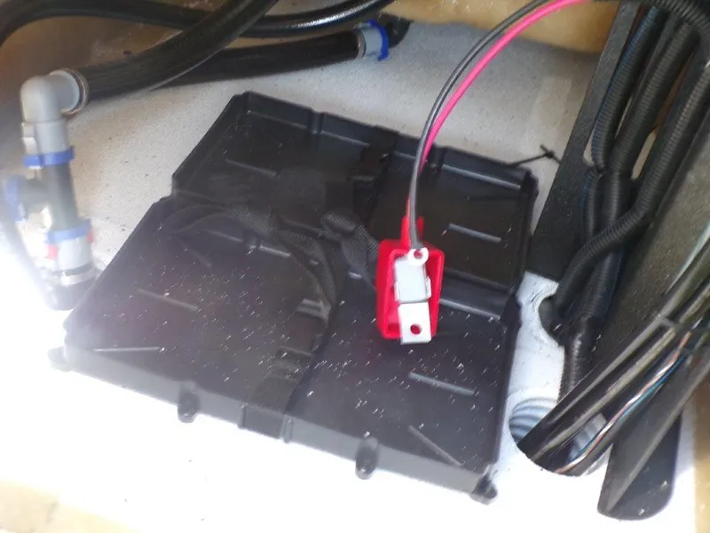 Slide: The Image of Battery compartment of 2025 Xpress H20BAY boat with wiring and connectors. - 6