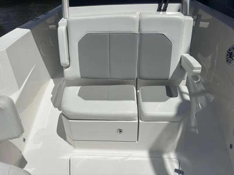 Slide: The Image of 2022 Pursuit S 288 boat seating with white and gray cushions. - 14
