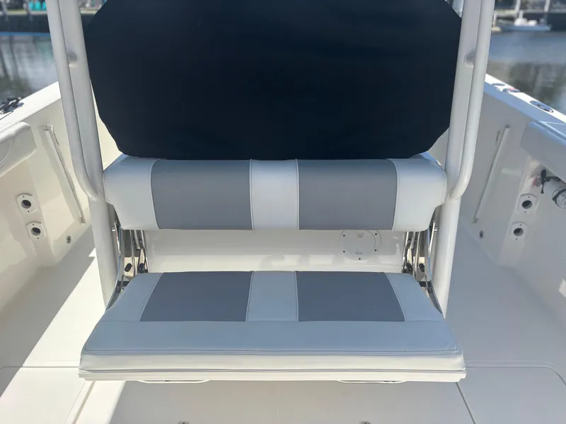 Slide: The Image of 2022 Pursuit S 288 boat seat with gray and white upholstery. - 24