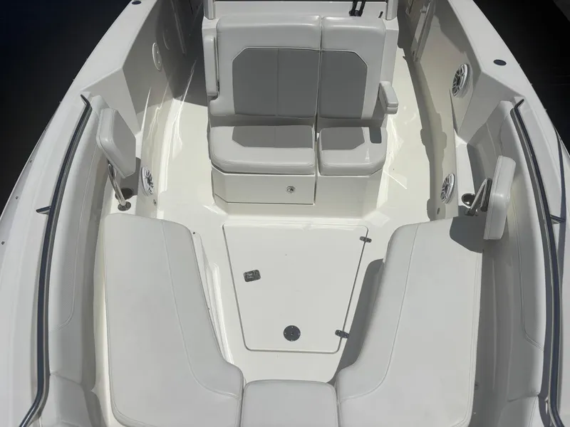 Slide: The Image of 2022 Pursuit S 288 boat interior with cushioned seating and storage compartments. - 9