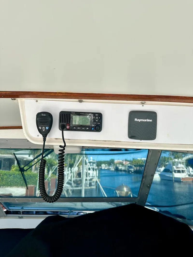 Slide: The Image of 1974 Bertram 42 Motor Yacht interior with radio and Raymarine equipment. - 21