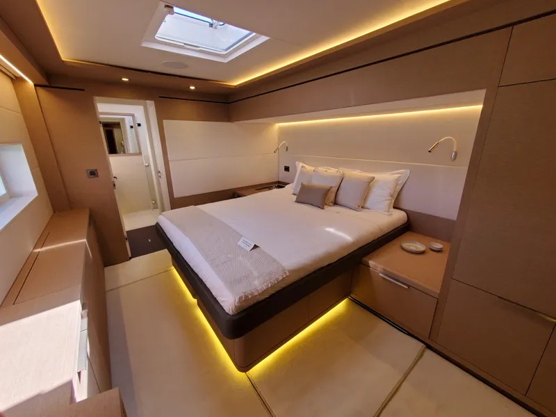 Slide: The Image of Luxurious bedroom interior of 2020 Lagoon SEVENTY 7 yacht with modern lighting and elegant design. - 11