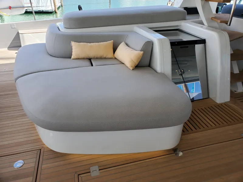 Slide: The Image of Luxurious seating area on 2020 Lagoon SEVENTY 7 yacht with cushions and wooden deck. - 15
