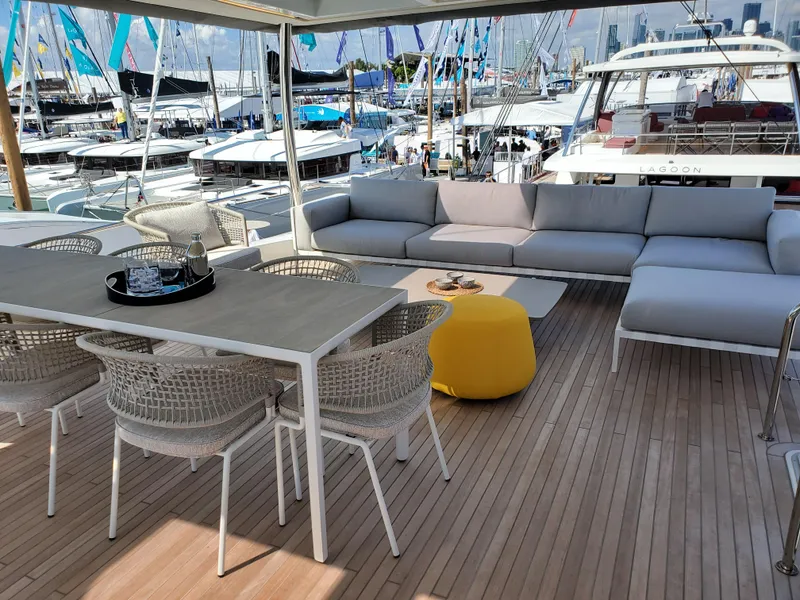 Slide: The Image of Spacious deck of 2020 Lagoon SEVENTY 7 yacht with modern seating and dining area. - 17