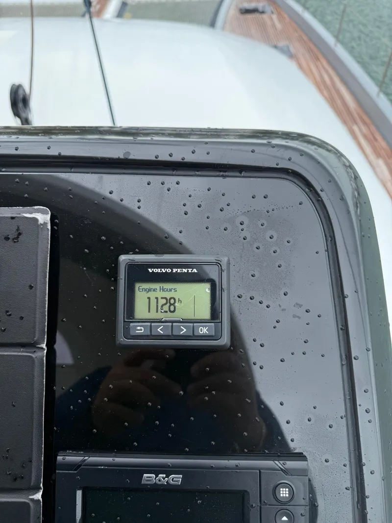 Slide: The Image of Close-up of a 2020 Lagoon SEVENTY 7 engine hour meter displaying 1128 hours. - 32