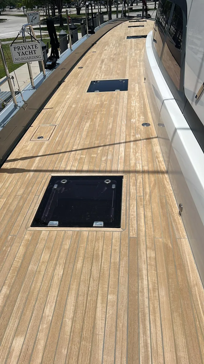 Slide: The Image of 2020 Lagoon SEVENTY 7 yacht deck with sleek wooden finish and modern design. - 36