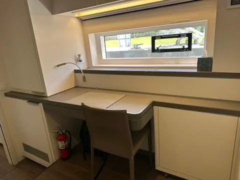 Slide: The Image of Modern desk area in 2020 Lagoon SEVENTY 7 yacht, featuring sleek design and window view. - 48