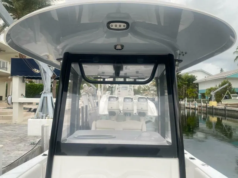 Slide: The Image of 2018 Sea Hunt Gamefish 27 boat docked near waterfront homes. - 11