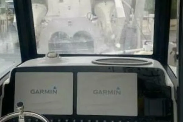 Slide: The Image of 2018 Sea Hunt Gamefish 27 dashboard with dual Garmin displays. - 18