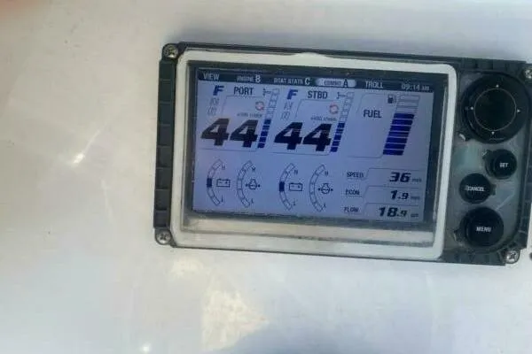 Slide: The Image of Display screen on 2018 Sea Hunt Gamefish 27 showing engine and fuel data. - 20