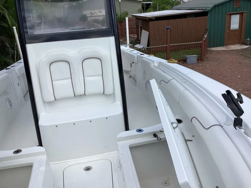 Slide: The Image of 2018 Sea Hunt Gamefish 27 boat interior with seating and storage compartments. - 26