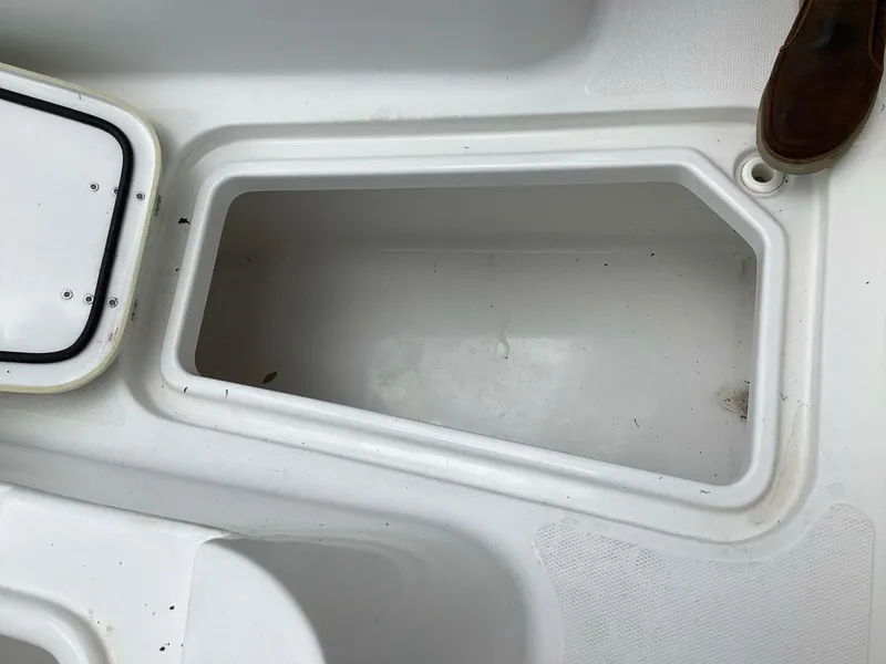 Slide: The Image of Open storage compartment on a 2018 Sea Hunt Gamefish 27 boat. - 29