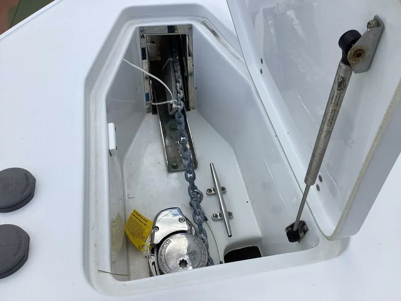 Slide: The Image of Anchor locker of 2018 Sea Hunt Gamefish 27 boat with chain and hydraulic support. - 31