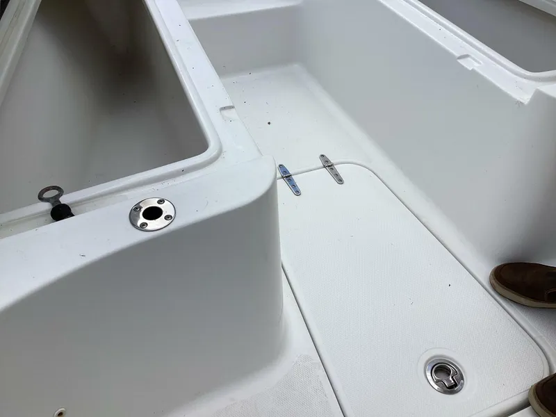 Slide: The Image of 2018 Sea Hunt Gamefish 27 boat interior, featuring storage compartments and deck details. - 36