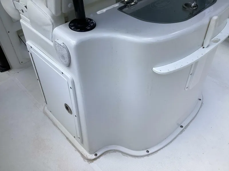 Slide: The Image of 2018 Sea Hunt Gamefish 27 boat interior detail, featuring storage compartment and seating area. - 42