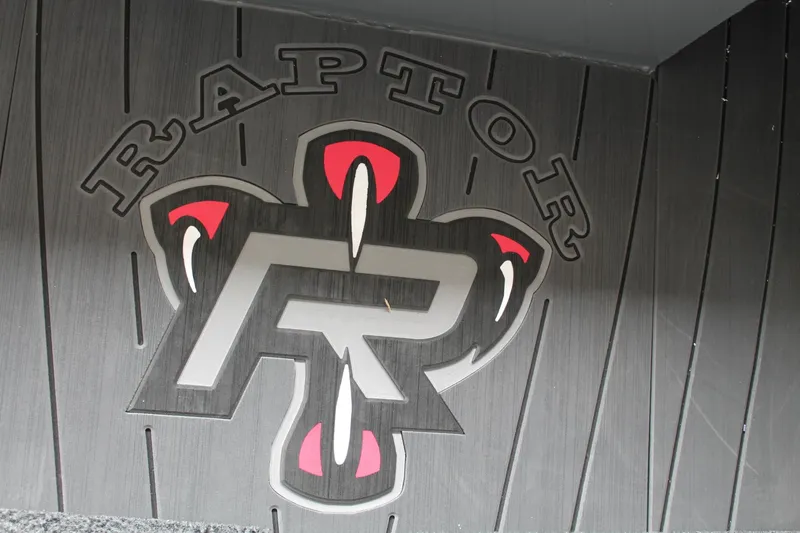 Slide: The Image of Raptor logo on Vexus AVX2080 boat floor, 2025 model, featuring bold design elements. - 11